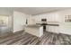 Bright kitchen features an island, granite countertops, stainless steel appliances and ample white cabinetry at 418 Wintergreen Ct, Kings Mountain, NC 28086
