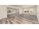 Inviting living space featuring durable floors, neutral paint, and an open layout connecting to the kitchen area at 418 Wintergreen Ct, Kings Mountain, NC 28086