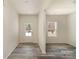 Bright, open room featuring attractive flooring, neutral walls, and a doorway leading to the outside at 418 Wintergreen Ct, Kings Mountain, NC 28086