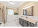 Bathroom featuring a single sink vanity with granite countertop and a shower/tub combination at 600 S Central Ave, Belmont, NC 28012