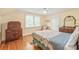 Bedroom featuring hardwood floors, neutral walls, and vintage furniture at 600 S Central Ave, Belmont, NC 28012