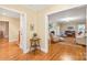 Hallway leading to formal living room with hardwood flooring and neutral wall paint at 600 S Central Ave, Belmont, NC 28012