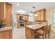 Well-appointed kitchen with wooden cabinets, granite countertops, and stainless steel appliances at 600 S Central Ave, Belmont, NC 28012