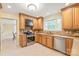 Updated kitchen with stainless steel appliances, granite countertops, and a cozy breakfast nook at 600 S Central Ave, Belmont, NC 28012