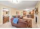 Open-concept living room with a fireplace, hardwood floors, and seamless flow to the kitchen at 600 S Central Ave, Belmont, NC 28012