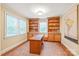 Bright home office with built-in bookshelves, desk, and natural light at 600 S Central Ave, Belmont, NC 28012