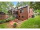 Back of the house showcasing brick exterior and a fenced yard at 600 S Central Ave, Belmont, NC 28012