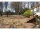 Backyard with trees and a wooden porch at 7597 Webbs Rd, Denver, NC 28037
