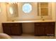 Bright bathroom boasting dual sinks, vanity, and ample lighting, creating a functional and stylish space at 7597 Webbs Rd, Denver, NC 28037