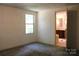 Cozy bedroom featuring a window, carpeted floor, and neutral walls, offering a serene living space at 7597 Webbs Rd, Denver, NC 28037