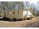 Exterior view of home featuring a deck and small front porch at 7597 Webbs Rd, Denver, NC 28037