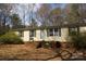 Exterior of home with a brick porch and two chairs at 7597 Webbs Rd, Denver, NC 28037