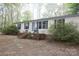 Exterior of home with a brick porch and multiple chairs at 7597 Webbs Rd, Denver, NC 28037
