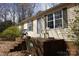 Exterior of home with a brick porch and two chairs at 7597 Webbs Rd, Denver, NC 28037
