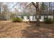Attractive home with a well-manicured front lawn, offering a blend of comfort and suburban charm at 7597 Webbs Rd, Denver, NC 28037