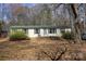 Cozy home featuring a well-kept lawn and charming front porch, ideal for relaxing and enjoying the outdoors at 7597 Webbs Rd, Denver, NC 28037