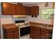 Well-lit kitchen equipped with wooden cabinets and a double sink, ready for culinary endeavors at 7597 Webbs Rd, Denver, NC 28037