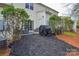 Backyard with an outdoor patio set, mulch, and lush greenery; great for outdoor entertaining at 8364 Chaceview Ct, Charlotte, NC 28269
