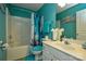 Bathroom with a bathtub, toilet, sink, and a blue color scheme at 8364 Chaceview Ct, Charlotte, NC 28269