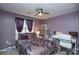 Bedroom with bed, desk, and purple walls at 8364 Chaceview Ct, Charlotte, NC 28269
