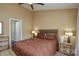 Comfortable bedroom featuring a ceiling fan, neutral walls, and a cozy queen-sized bed with matching lamps at 8364 Chaceview Ct, Charlotte, NC 28269