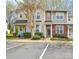 Inviting townhome exterior with manicured landscaping, brick accents, and convenient parking at 8364 Chaceview Ct, Charlotte, NC 28269
