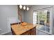 Kitchen island with granite countertop, seating, and view of the backyard at 8364 Chaceview Ct, Charlotte, NC 28269