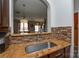 Stainless steel sink and faucet with granite countertops and decorative backsplash at 8364 Chaceview Ct, Charlotte, NC 28269
