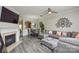 Spacious living room featuring a fireplace, large sectional, and open floor plan at 8364 Chaceview Ct, Charlotte, NC 28269