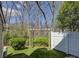 View of backyard with wooden pergola, fencing, and green shrubbery at 961 Sardis Cove Dr, Charlotte, NC 28270