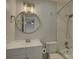 Modern bathroom with a round mirror, white vanity, and a tiled shower at 961 Sardis Cove Dr, Charlotte, NC 28270