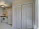 Dining area next to the kitchen features tile floors and bi-fold closet doors at 961 Sardis Cove Dr, Charlotte, NC 28270