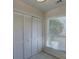 Bright dining area with white bi-fold doors and a window with white blinds at 961 Sardis Cove Dr, Charlotte, NC 28270