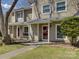 Close-up of a lovely townhome showcasing the front entry, lush lawn, and well-kept landscaping at 961 Sardis Cove Dr, Charlotte, NC 28270