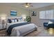 Staged main bedroom with a plush bed, blue accents, and natural light at 961 Sardis Cove Dr, Charlotte, NC 28270