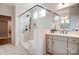 Elegant bathroom featuring a glass-enclosed shower, marble walls, and a vanity with shaker cabinets at 1018 Heritage Pointe # 302, Indian Trail, NC 28079