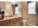 Neutral bathroom featuring shaker cabinets, a tiled shower, and decorative artwork at 1018 Heritage Pointe # 302, Indian Trail, NC 28079