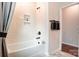 Bright bathroom featuring a white tub, a tiled shower niche, neutral walls, and modern fixtures at 1018 Heritage Pointe # 302, Indian Trail, NC 28079