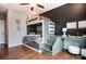 Fun bedroom featuring a lofted bed with stairs leading up to a workspace and a chalkboard accent wall at 1018 Heritage Pointe # 302, Indian Trail, NC 28079