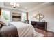 Bright bedroom featuring large windows, tray ceiling and a stylish mirror above the dresser at 1018 Heritage Pointe # 302, Indian Trail, NC 28079