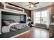 Stylish bedroom featuring custom bunkbeds, hardwood floors, an accent wall, and lots of natural light at 1018 Heritage Pointe # 302, Indian Trail, NC 28079