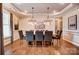 Dining room featuring hardwood floors, decorative ceiling, chandelier and modern decor at 1018 Heritage Pointe # 302, Indian Trail, NC 28079