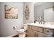 Neutral half bathroom featuring a stylish vanity, decorative mirror, and modern fixtures at 1018 Heritage Pointe # 302, Indian Trail, NC 28079