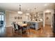Well-lit kitchen with an island, a dining area, stainless steel appliances, and plenty of counter space at 1018 Heritage Pointe # 302, Indian Trail, NC 28079
