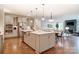 Well-lit open concept kitchen featuring an island, stainless steel appliances and plenty of storage at 1018 Heritage Pointe # 302, Indian Trail, NC 28079