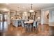 Spacious kitchen featuring an island, pendant lighting, stainless steel appliances, and ample counter space at 1018 Heritage Pointe # 302, Indian Trail, NC 28079