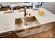 Modern farmhouse kitchen features a large undermount sink, quartz countertops and stainless steel appliances at 1018 Heritage Pointe # 302, Indian Trail, NC 28079