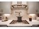 Kitchen features modern fixtures, stainless steel appliances, a pot filler and neutral tones at 1018 Heritage Pointe # 302, Indian Trail, NC 28079