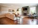 Inviting living room with a cozy fireplace, large windows, hardwood floors, and comfortable seating at 1018 Heritage Pointe # 302, Indian Trail, NC 28079