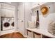 Convenient mudroom featuring a bench with storage, and access to the laundry room for added functionality at 1018 Heritage Pointe # 302, Indian Trail, NC 28079